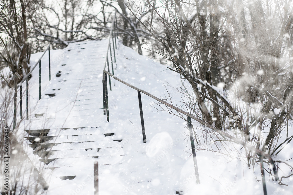 A man walks through the city on snowy winter day. A man walks through the city on snowy winter day.