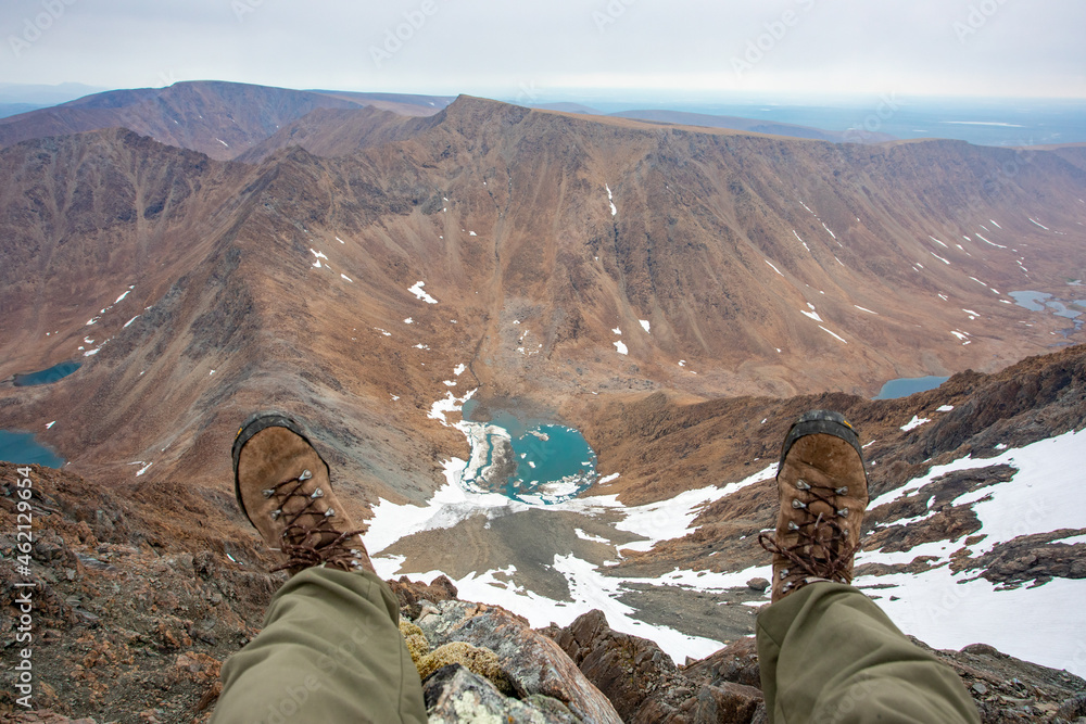 Fototapeta premium The concept of outdoor activities in the mountains. Minimalist mountain landscape. Atmospheric view. The majestic nature of the Circumpolar Urals.
