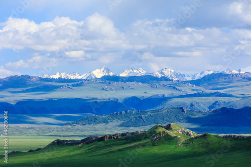 Green grassland and mountain natural landscape in Xinjiang,China.Beautiful prairie scenery. © ABCDstock