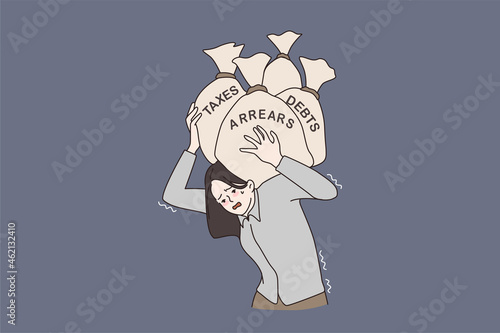 Unhappy woman carrying burden of financial problems, holding bags with taxes and debts. Distressed female suffer from finance troubles and bankruptcy. Budget crisis. Cartoon flat vector illustration. photo