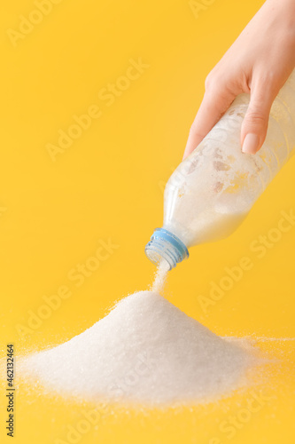 Woman sprinkling sugar from...