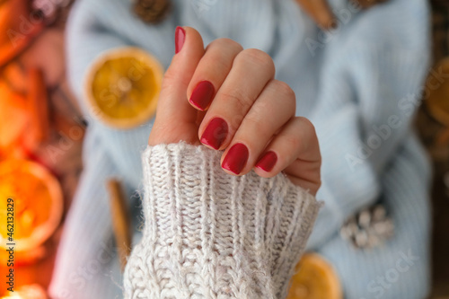 Fotografie Woman manicured hands, stylish red nails, copy space