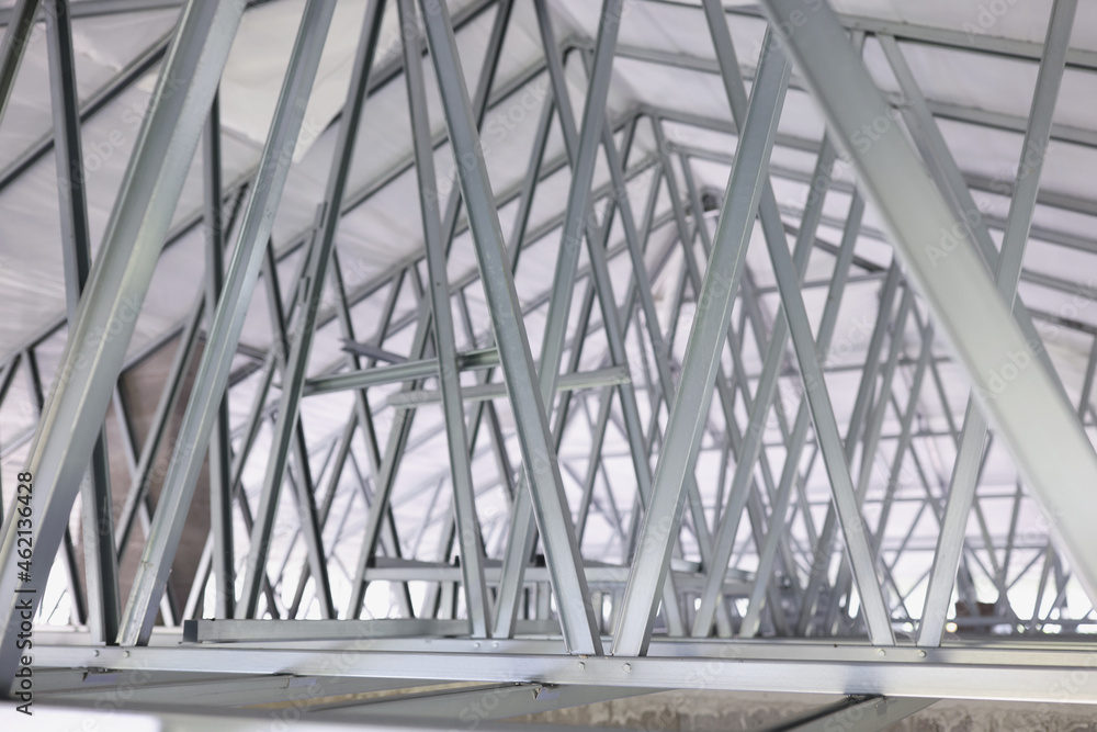 Structure of steel roof frame for building construction closeup Structure of steel roof frame for building construction closeup