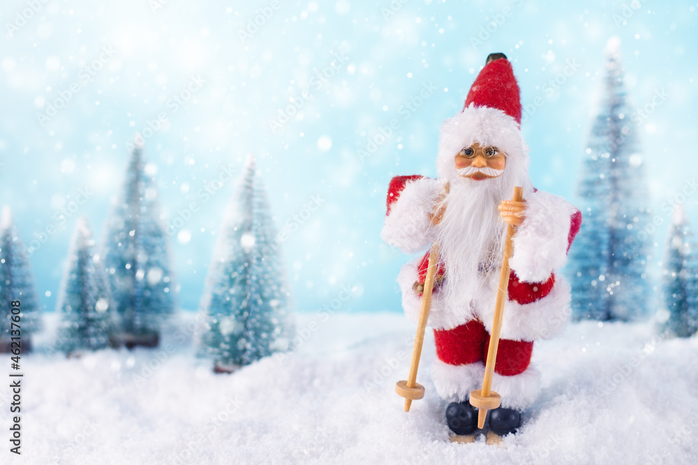 Christmas background with Samta Claus on ski in a winter landscape. Christmas greeting card. Winter time. Christmas background with Samta Claus on ski in a winter landscape. Christmas greeting card. Winter time.