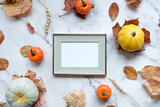 Thanksgiving day, harvesting mockup. Blank poster frame and autumn decorations. Flat lay design. Mockup poster for Thanksgiving day congratulations.