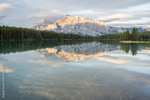 Peaceful colorful sunrise with dominant mountain reflecting on still lake´ s surface, Banff National Park,Canada