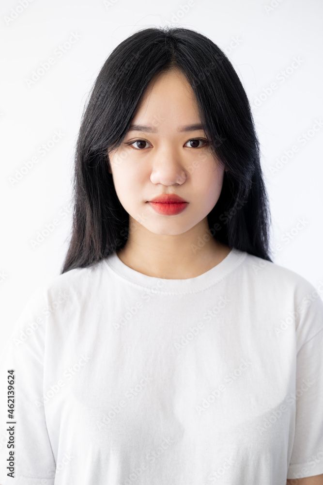 Asian beauty. Pretty woman. Fresh skin. Casual look. Natural care. Charming dark haired lady red lipstick isolated white. Asian beauty. Pretty woman. Fresh skin. Casual look. Natural care. Charming dark haired lady red lipstick isolated white.
