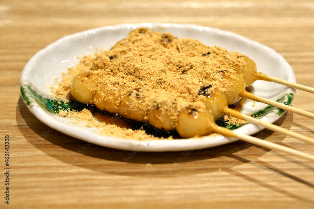 Kyoto,Japan - October 7, 2021: Closeup of Traditional mitarashi dango, or sweet soy sauce glazed rice dumplings on a plate
Kyoto,Japan - October 7, 2021: Closeup of Traditional mitarashi dango, or sweet soy sauce glazed rice dumplings on a plate