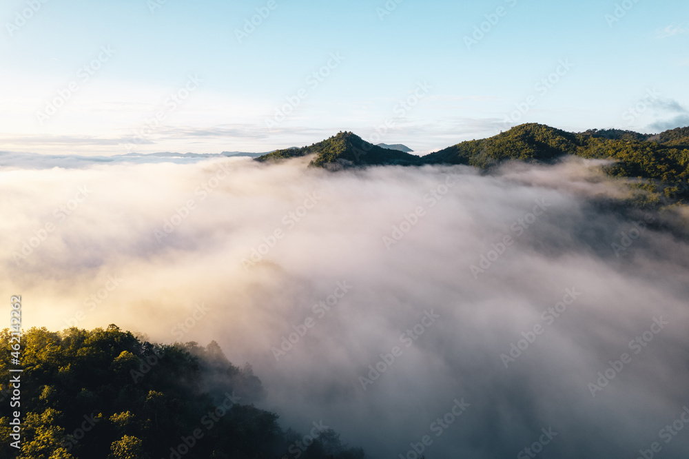 The sun rises in the mist and mountains in the morning The sun rises in the mist and mountains in the morning