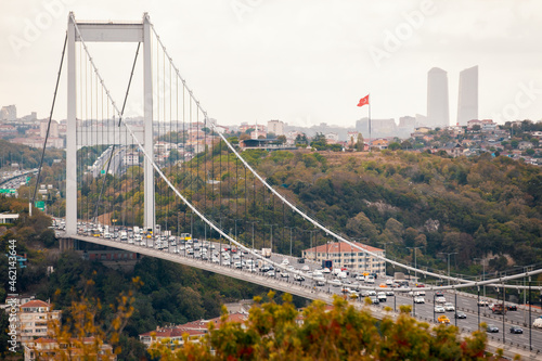 Heavy traffic on Istanbul Bosphorus Bridge | Bogazici Koprusu also known as 15th July Martyrs Bridge connecting Europe and Asia. Bridge has a total length of 1,560 m and height of 165 m. photo