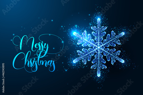 Abstract glowing polygonal snowflake isolated on dark blue background. Merry Christmas greeting card
