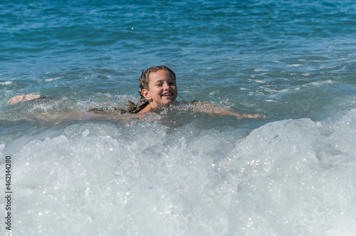 Wallpaper Mural Little happy adorable girl child swims in the sea and plays on the waves during the holidays on the sea coast	
 Torontodigital.ca