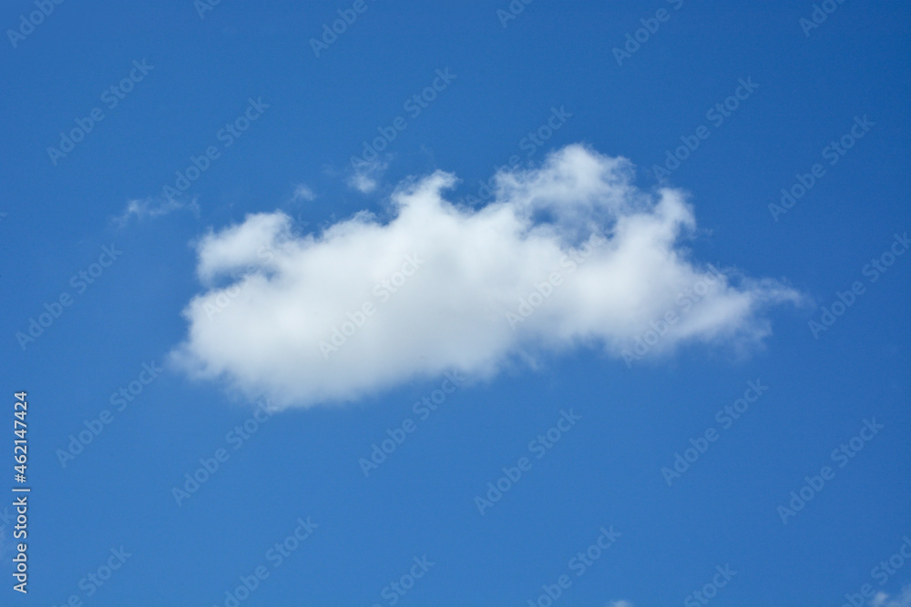 White clouds against clear blue sky for background or template White clouds against clear blue sky for background or template