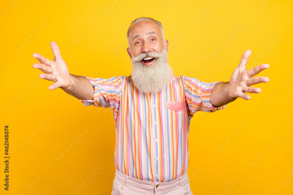 Photo of funny friendly age gentleman wear striped shirt smiling open arms inviting hugging isolated yellow color background - obrazy, fototapety, plakaty 
