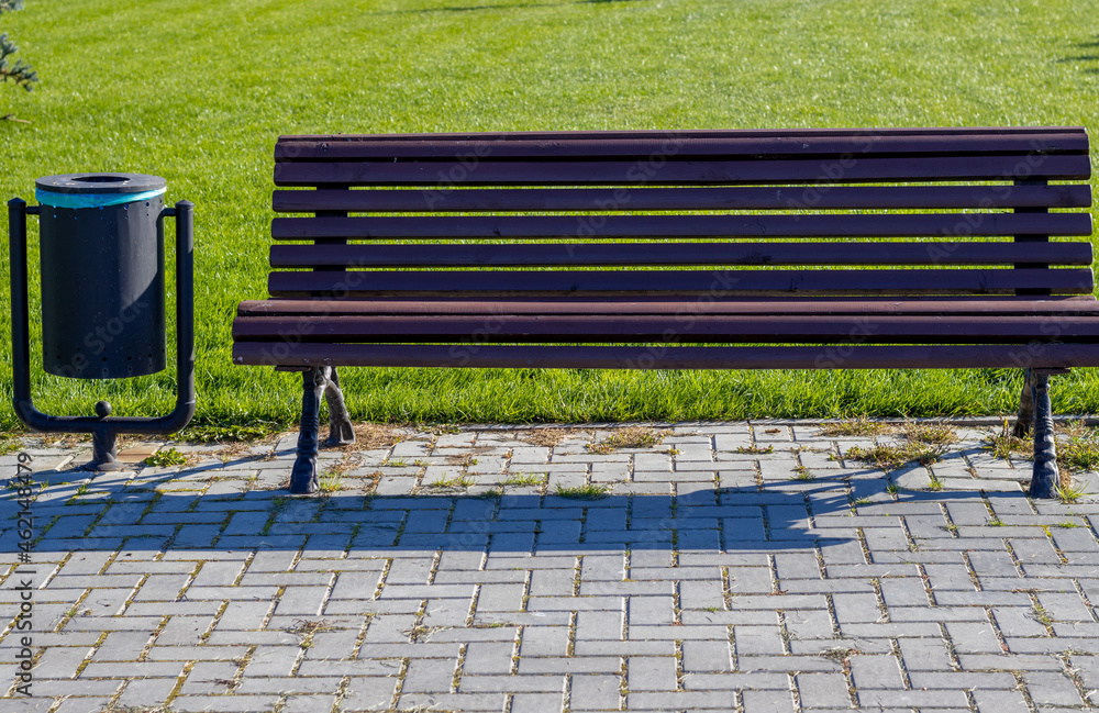 public park bench and trash bin.green grass background, walkside concept:keep clean, eco environment, relax autumn, summer.collect garbage public park bench and trash bin.green grass background, walkside concept:keep clean, eco environment, relax autumn, summer.collect garbage
