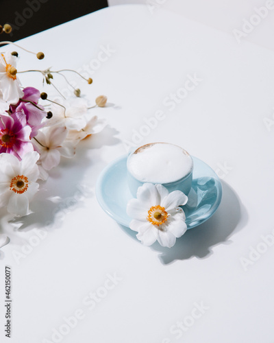 Beautiful blue vintage coffee cup with flowers and cappuccino, for lifestyle