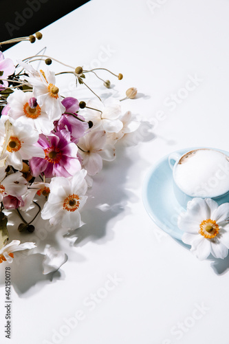 Beautiful blue vintage coffee cup with flowers and cappuccino, for lifestyle