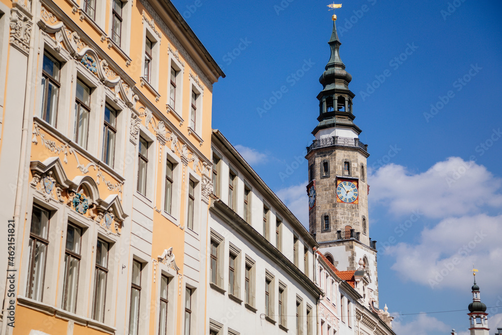 Goerlitz, Saxony, Germany, 04 September 2021: Historical Town hall or Rathaus, antique clock with two dials and moon calender on tower at Lower Market Square or Untermarkt at sunny summer day