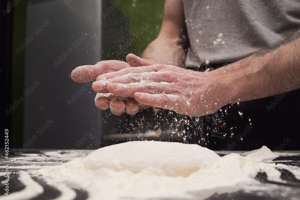 Hands in flour. Hand-made dough for homemade bread, pizza, pasta recipe