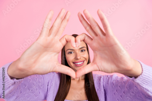 Photo of charming shiny young woman dressed purple clothes showing fingers heart cover face smiling isolated pink color background