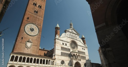 Duomo di Cremona. Cremona Cathedral and torrazzo.Facade of the cathedral covered in white Carrara marble. Statues and decorative arches.  