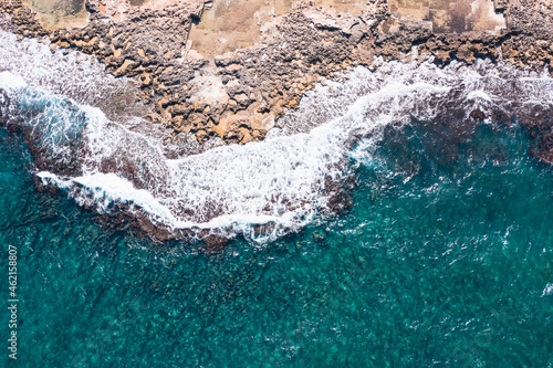 Aerial view of waves splashing on beach