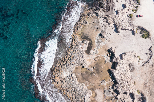 Aerial view of waves splashing on beach