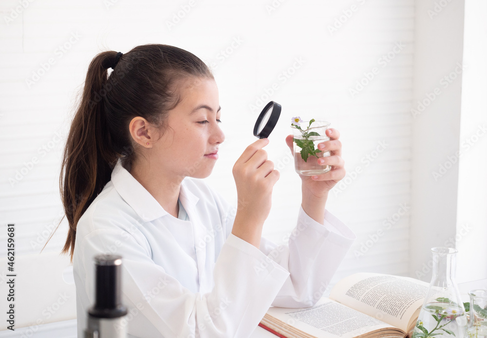 Little girl scientist making experiments in laboratory. Research and development concept. Little girl scientist making experiments in laboratory. Research and development concept.