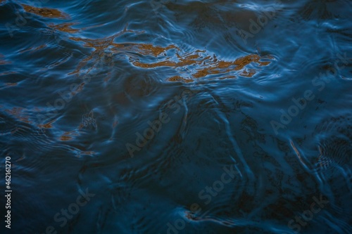 Small waves on the surface of the water  blue clear crystalline water