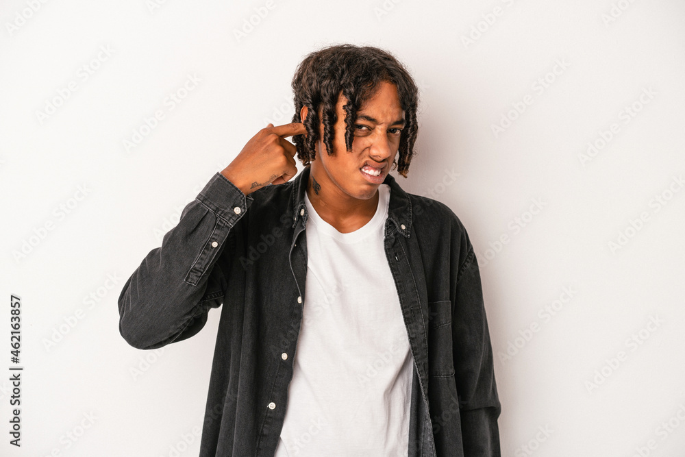 Young african american man isolated on white background covering ears with hands. Young african american man isolated on white background covering ears with hands.