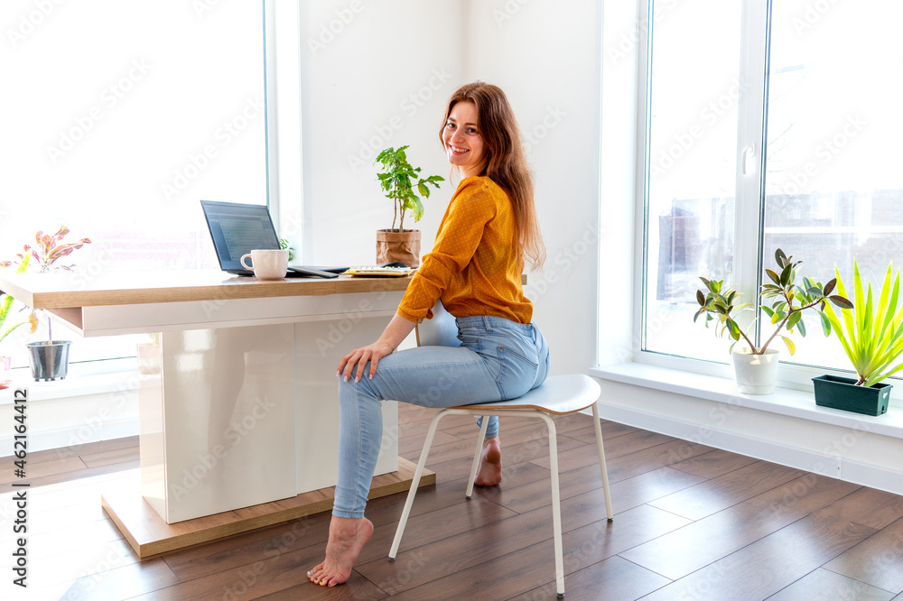 Defocus. Young business woman is meditating after work the Internet using a computer. Defocus. Young business woman is meditating after work the Internet using a computer.