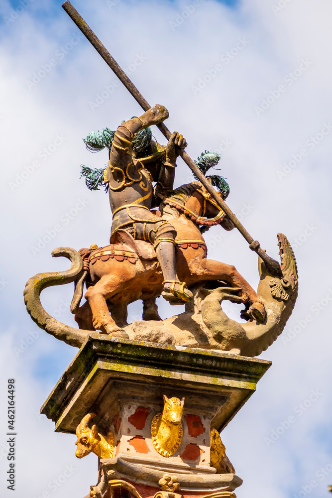 Obraz premium statue of Knight and Dragon at the column at central market square in Rothenburg, Germany