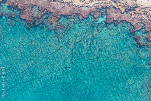 Aerial view of waves splashing on beach