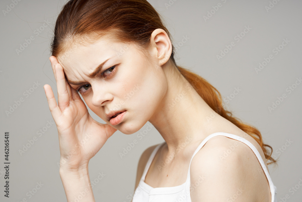 disgruntled woman holding head migraine disorder light background disgruntled woman holding head migraine disorder light background