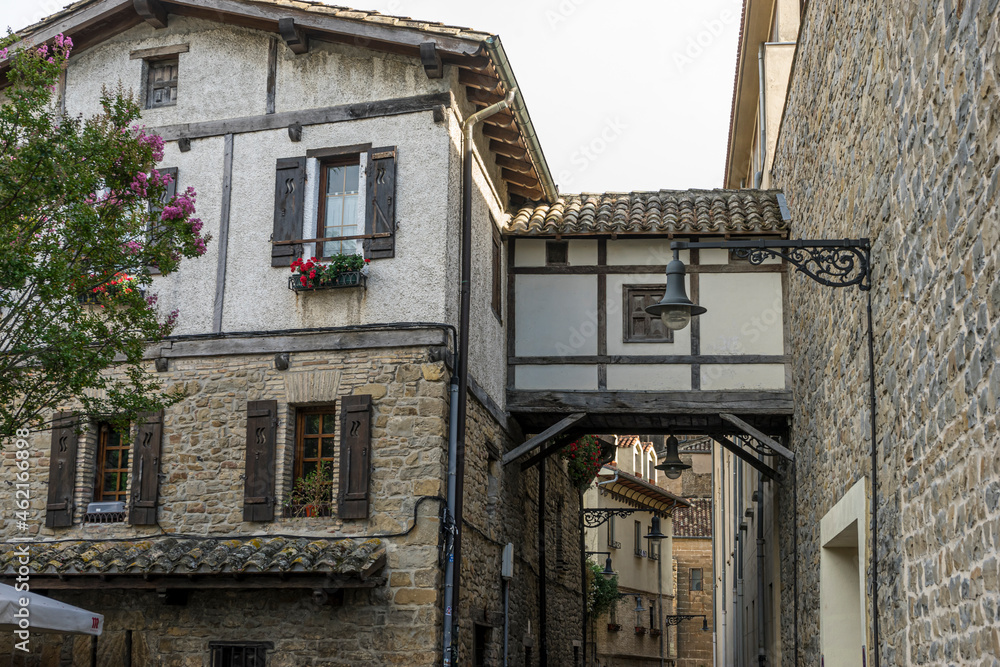 Facade of a medieval building in the center of Pamplona, medieval stone streets, typical and tourist alley of the city. Navarra Spain Facade of a medieval building in the center of Pamplona, medieval stone streets, typical and tourist alley of the city. Navarra Spain