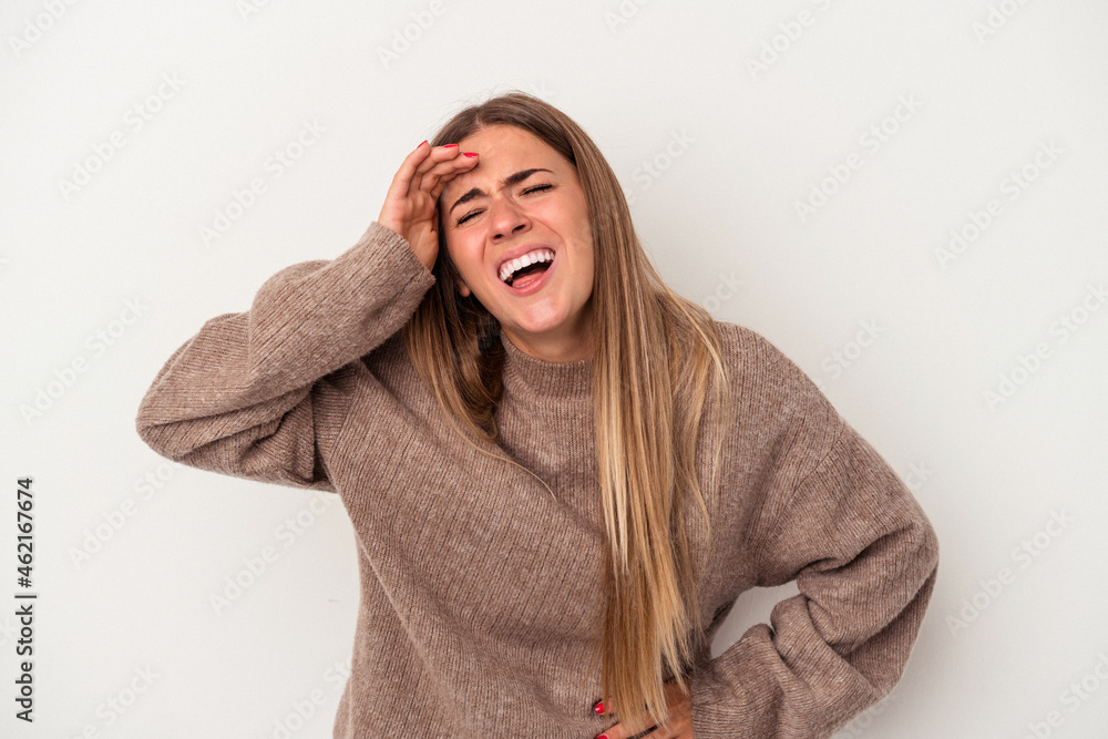 Young Russian woman isolated on white background laughing keeping hands on heart, concept of happiness. Young Russian woman isolated on white background laughing keeping hands on heart, concept of happiness.