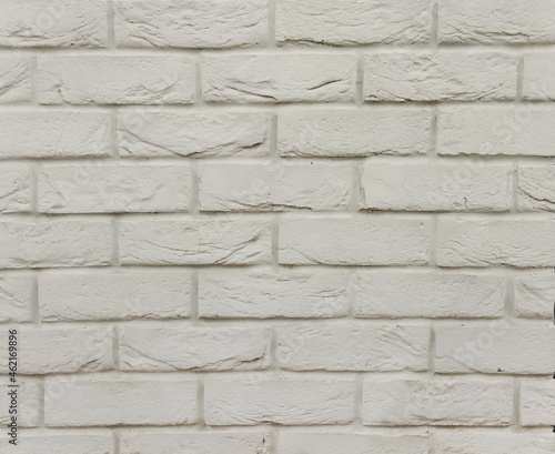 Horizontal brickwork is gray with damage. Gray background with brick texture. The old wall. 