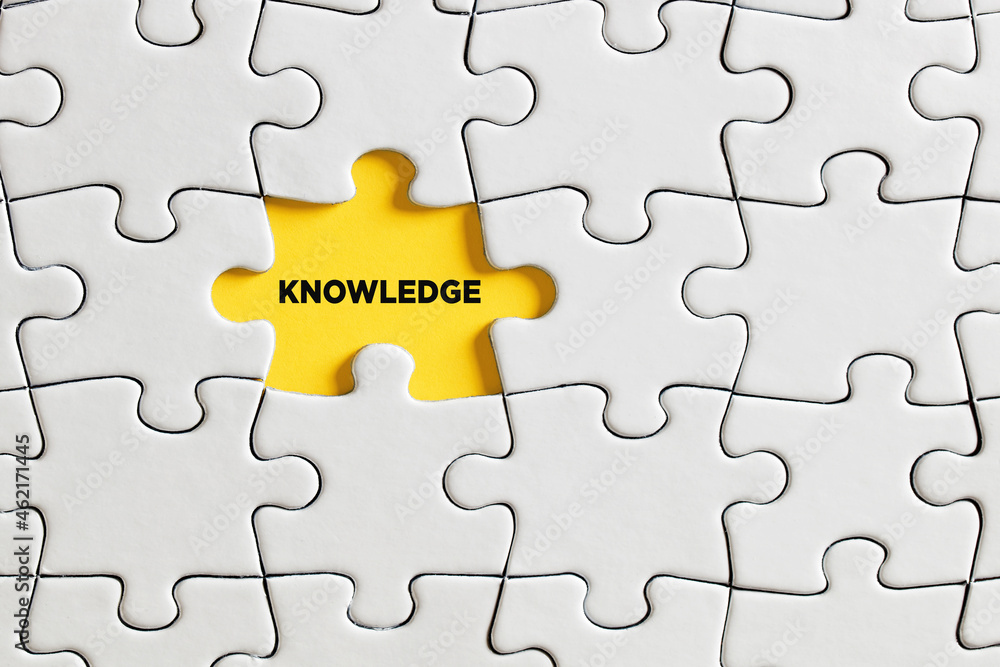 Fototapeta premium The word knowledge written on missing puzzle piece.