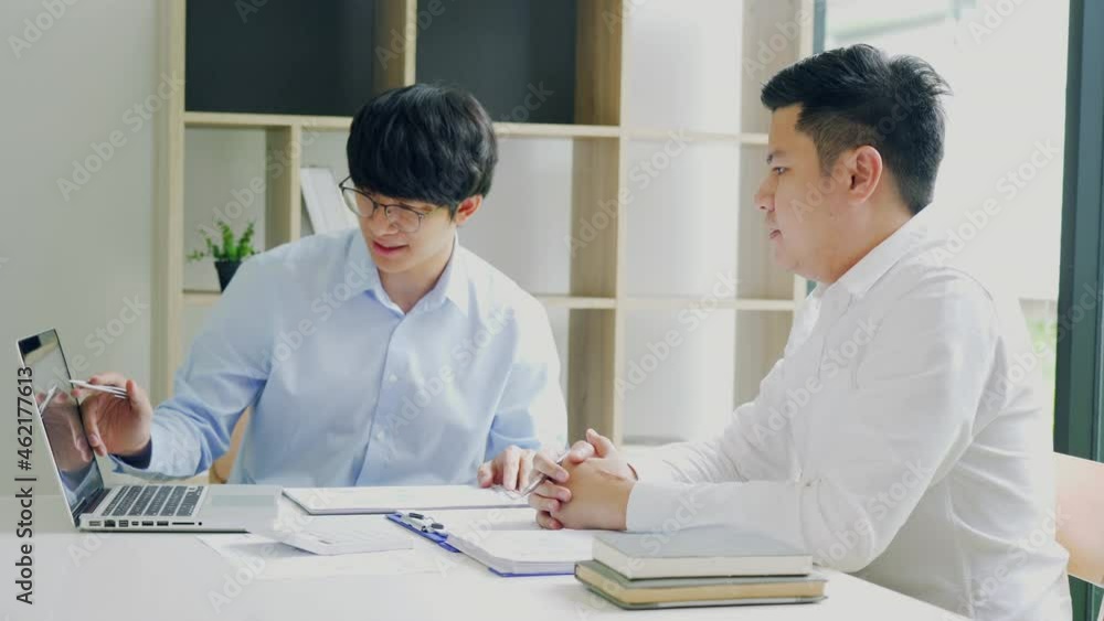 Businessman explaining financial budget figures in report paper to colleagues. Businessman explaining financial budget figures in report paper to colleagues.