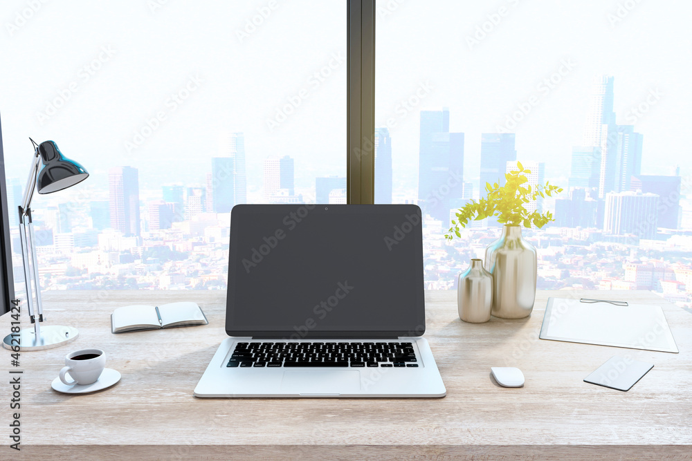 Creative designer desktop with empty laptop computer in modern interior with window and bright city view. Mock up, 3D Rendering. - obrazy, fototapety, plakaty 