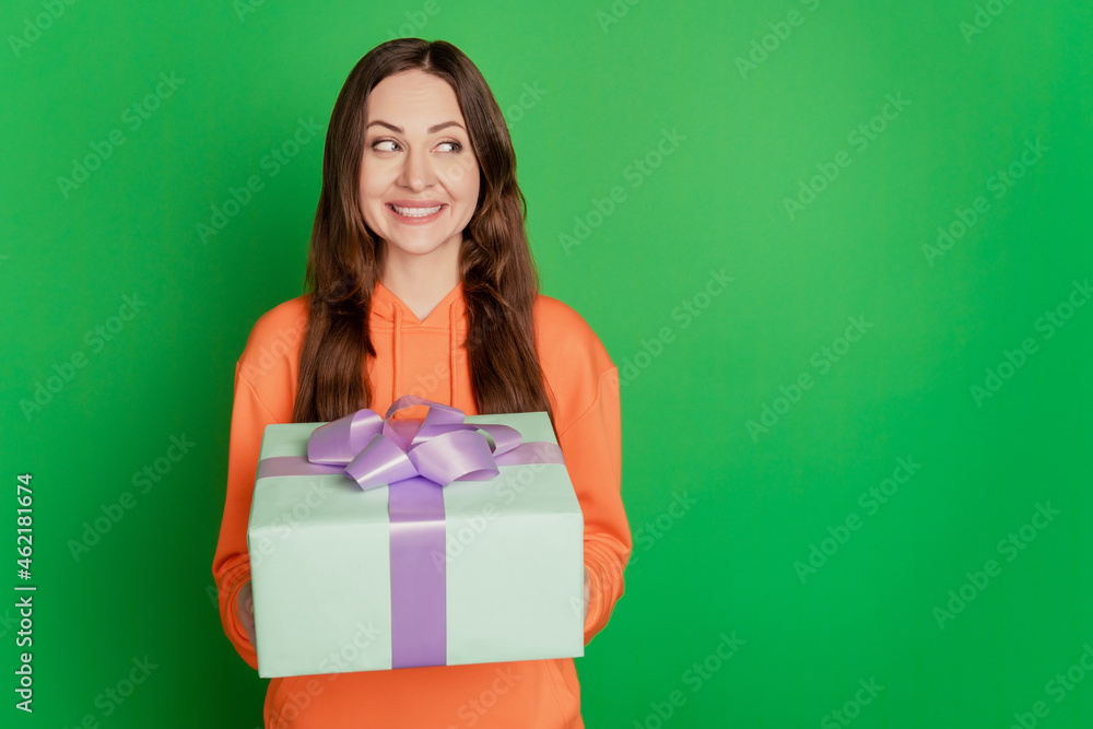 Portrait of lovely cute lady receive present look empty space on green background Portrait of lovely cute lady receive present look empty space on green background
