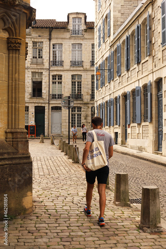 young tourist walking through the city photo