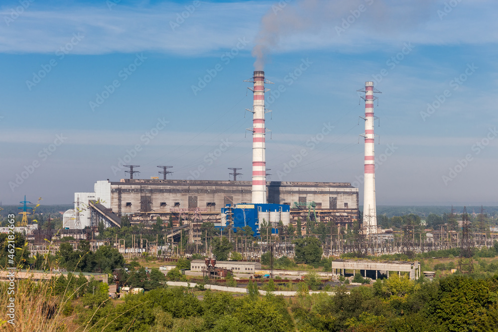 Fossil fuel thermal power station against the sky