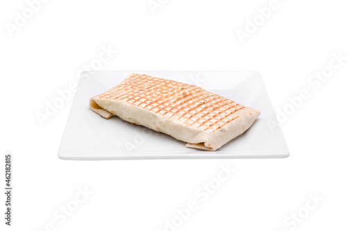 Tacos. French Tacos Galette sandwich in white plate on white background.
