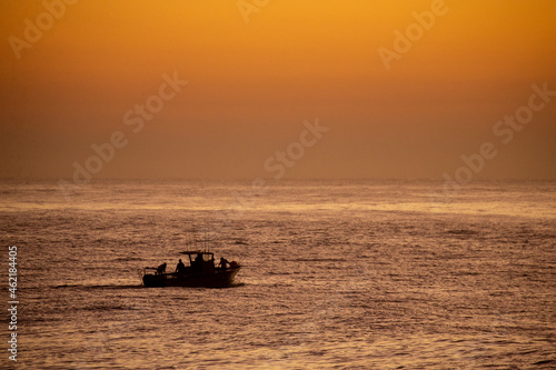 A fishing boat launches on the Indian Ocean, South Africa