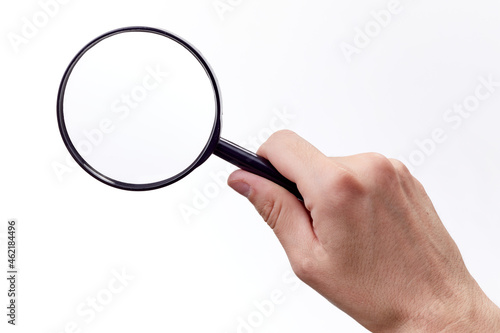 Magnifying glass in hand isolated on white background