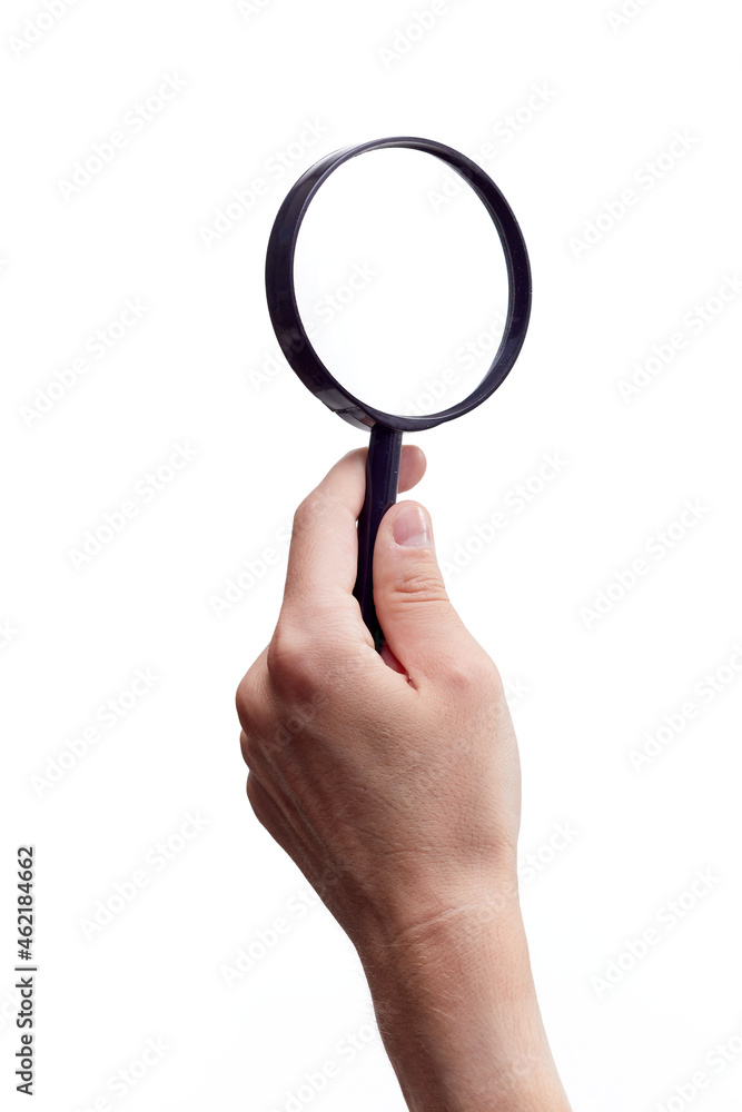 Magnifying glass in hand isolated on white background Magnifying glass in hand isolated on white background