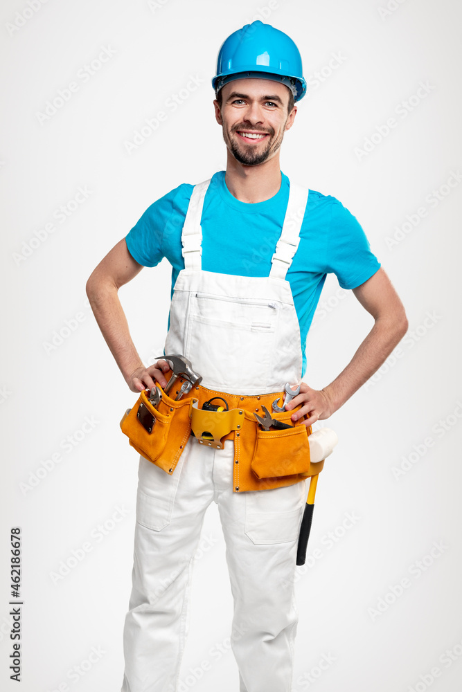 Positive contractor in uniform with tools Positive contractor in uniform with tools