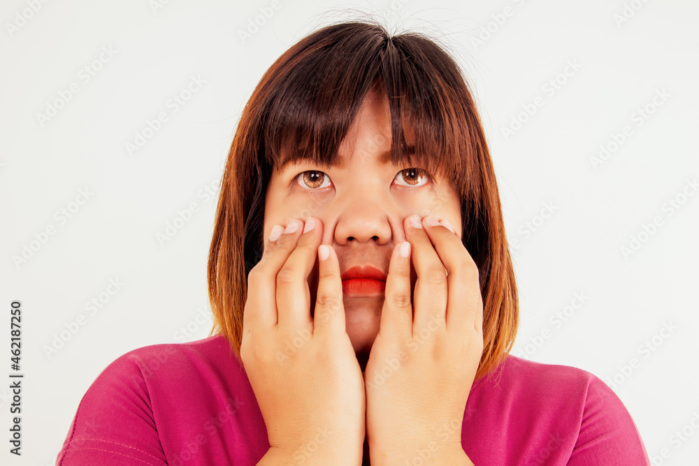 Concept of eye health : Obese women touch their face with their hands, have irritated their eyes due to wearing non-standard and unclean contact lenses. Concept of eye health : Obese women touch their face with their hands, have irritated their eyes due to wearing non-standard and unclean contact lenses.