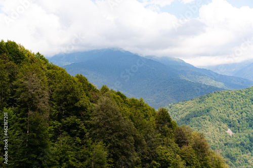 Scenic green mountains and beautiful sky clouds for background